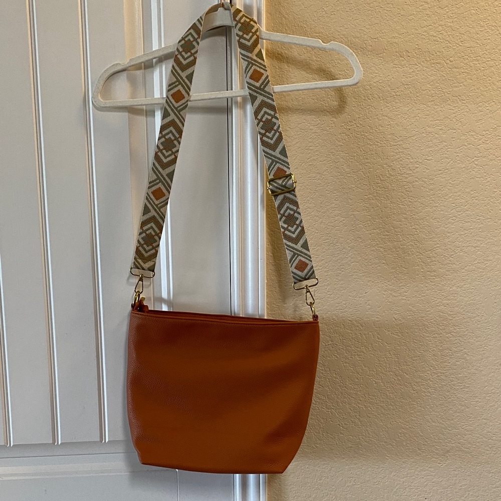 Stylish Burnt Orange Crossbody Bag with Patterned Strap